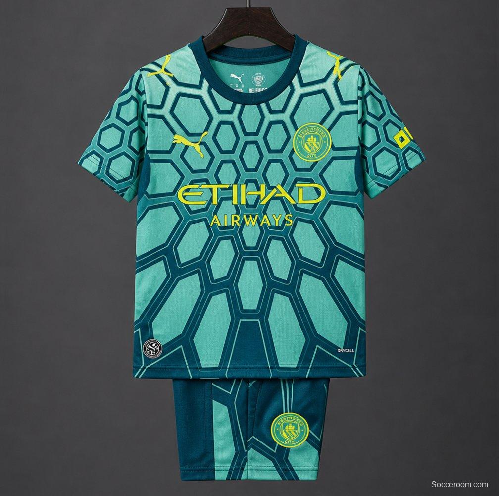 26/27 Kids Manchester City Vibrant Green Goalkeeper Jersey With Dark Blue Geometric Pattern.